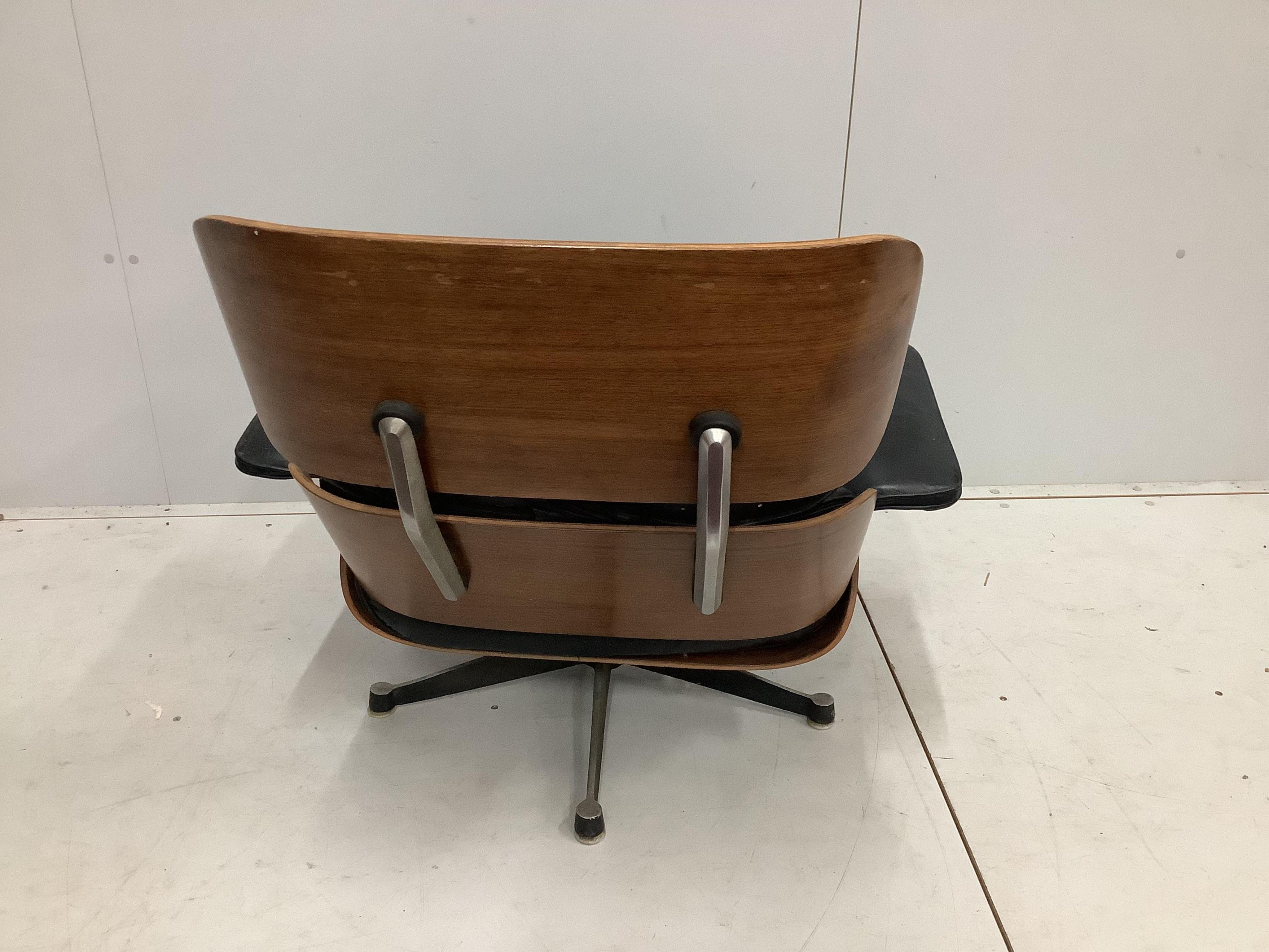 A Charles & Ray Eames for Herman Miller lounge chair, model 670, width 83cm, depth 90cm, height 80cm. Condition - poor